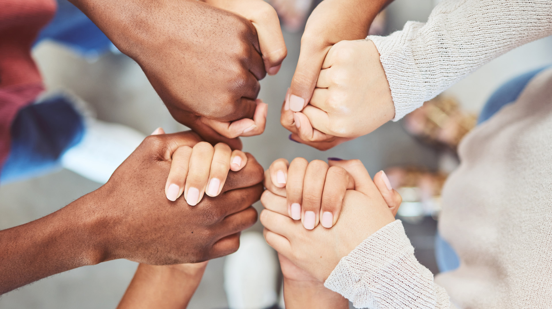 Photo of women holding hands